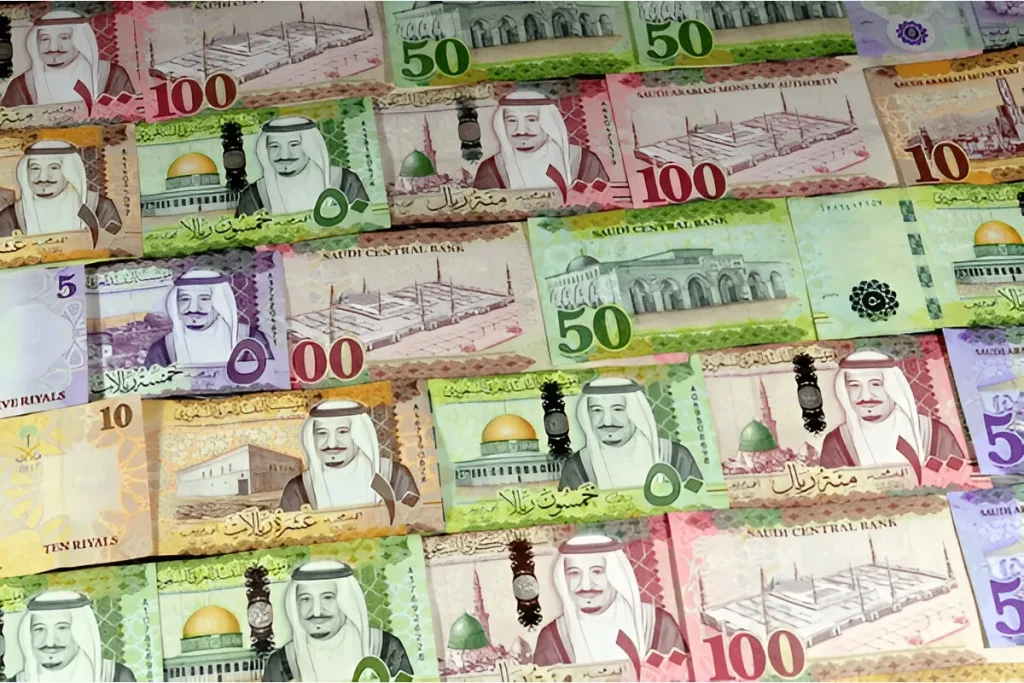 A set of Saudi riyal banknotes from Series 5, featuring intricate designs and security measures introduced in the 2000s to combat counterfeiting.